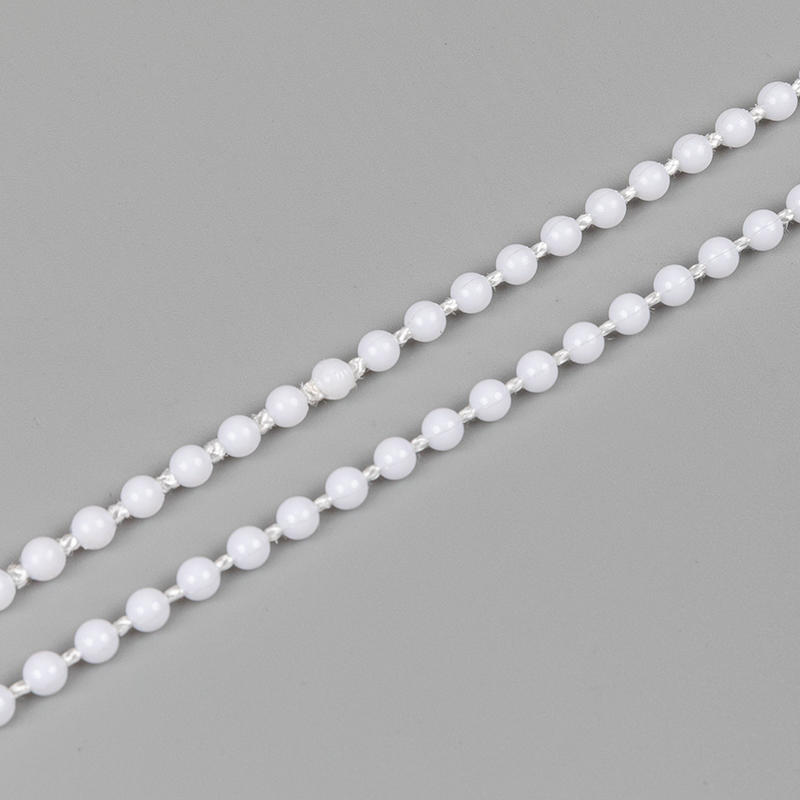 How do roller blind chains enhance the balance of curtains?