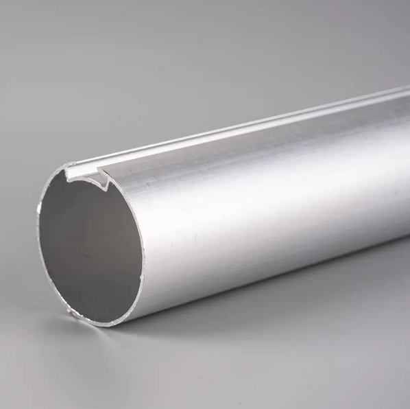 What is the purpose of the rollers or gliders on the curtain blind track?